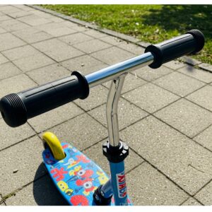 Close-up view of the sturdy handlebars and colorful deck of a 3 wheel childs scooter.
