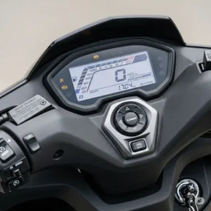 Detailed shot of the dashboard of a 200cc motorcycle scooter, showing the clear digital display and user-friendly controls.