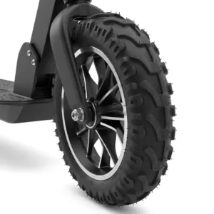 Close-up detail of the durable, large wheels on a scooter, showcasing the tread pattern designed for enhanced grip and shock absorption.