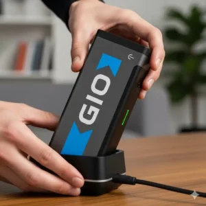 Close-up of a GIO electric scooter's removable lithium-ion battery, emphasizing the convenience of charging.