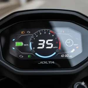 The clear and intuitive digital dashboard display of the Jolta electric scooter showing speed and battery life.