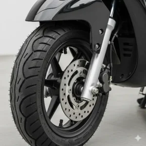 Detailed shot of the front wheel and suspension of a lambretta scooter for sale, demonstrating its road-ready condition.
