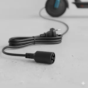 Close-up view of the 3 prong scooter charger plug, showing the correct alignment for the charging port.