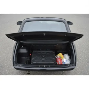 Ample under-seat storage compartment in a 2-person scooter, capable of holding two helmets. 